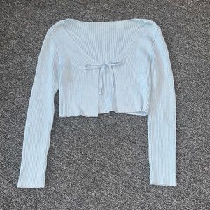 Women’s light blue babydoll sweater with adjustable Tie in front